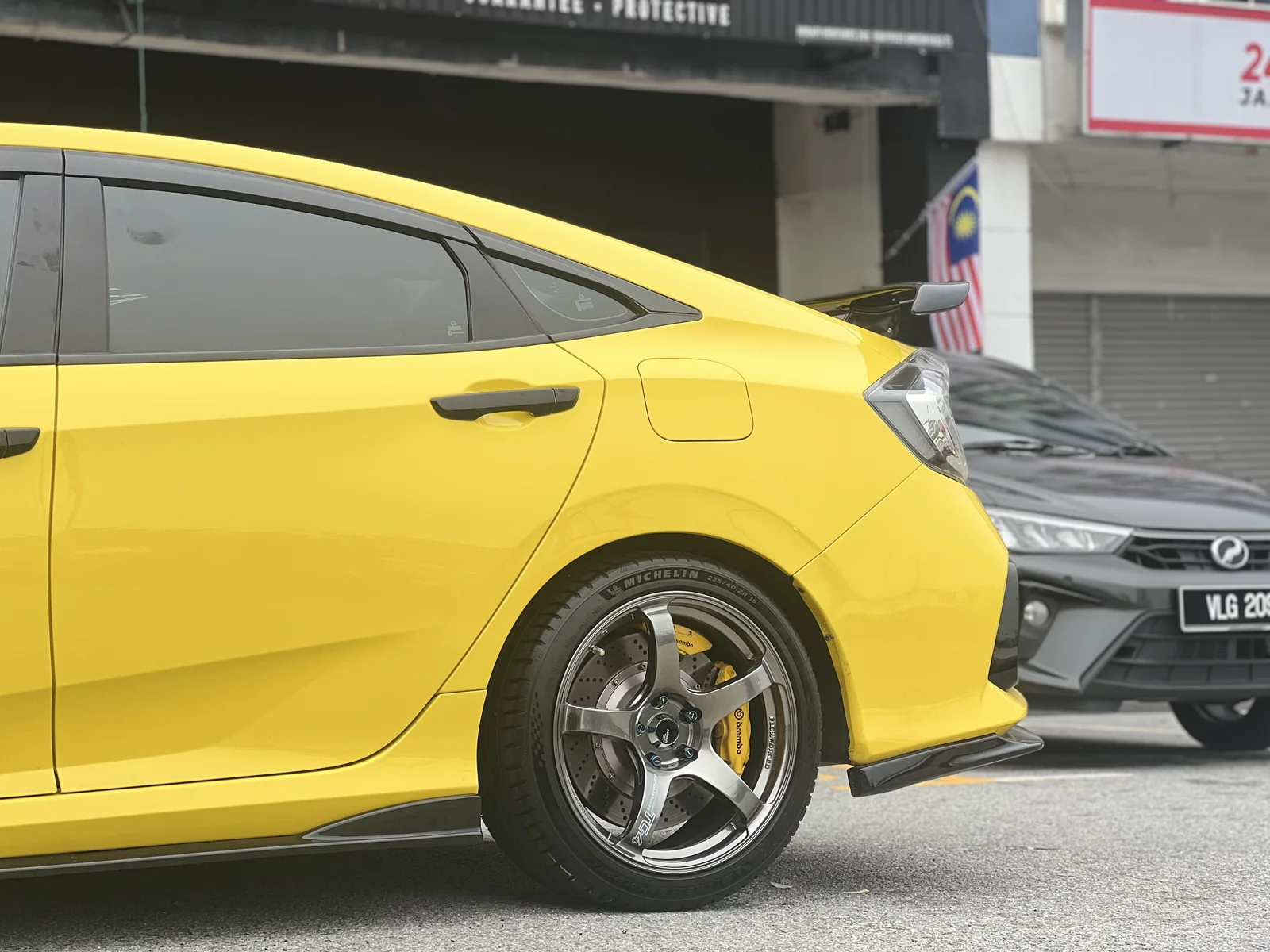 Yellow ASG customer car with a fitted performance wheel and brake setup