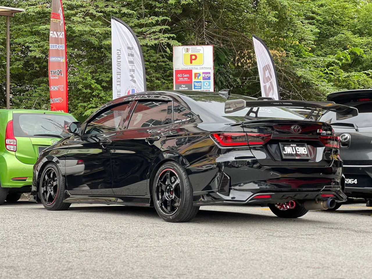 Black Toyota Vios rear three-quarter view with dark performance wheels