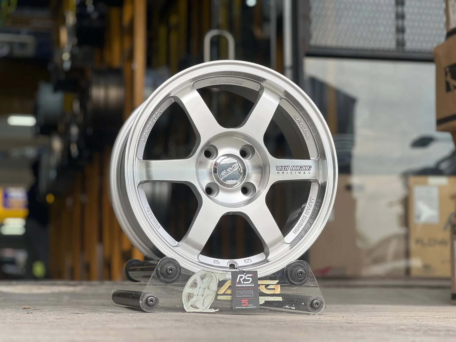 Silver five-spoke 15-inch sport rim displayed at Ahmad Sportrim Garage