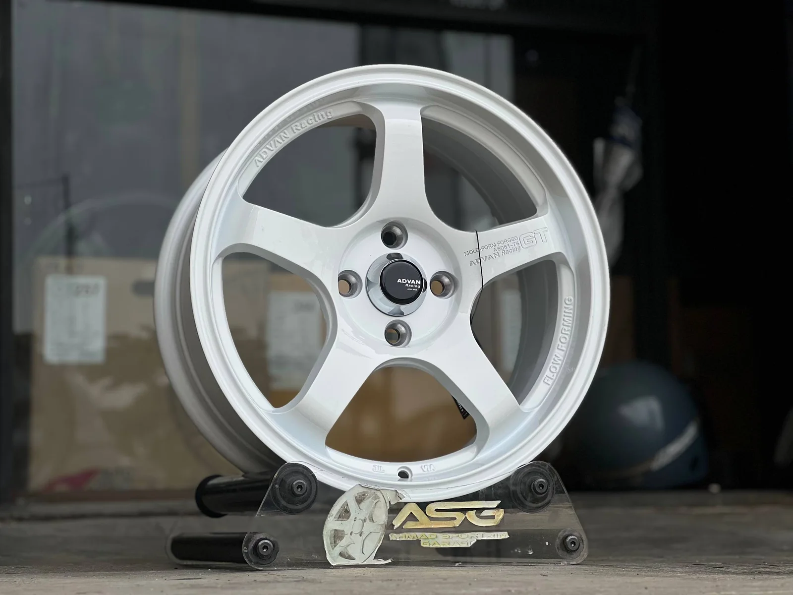 White five-spoke 16-inch sport rim displayed at Ahmad Sportrim Garage