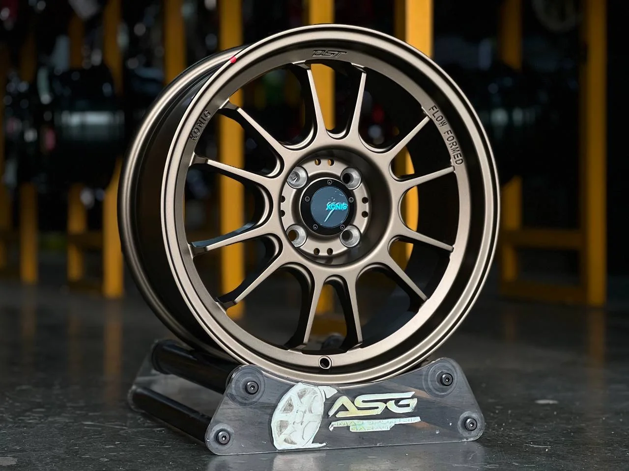 Bronze multi-spoke 16-inch sport rim displayed at Ahmad Sportrim Garage