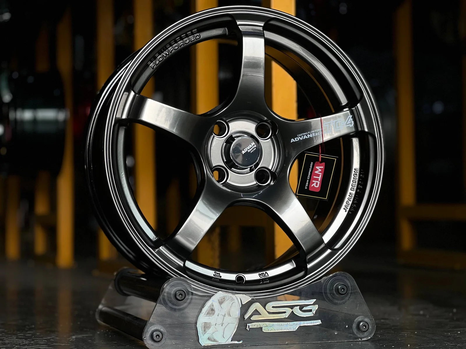 Gloss black six-spoke 16-inch sport rim displayed at Ahmad Sportrim Garage