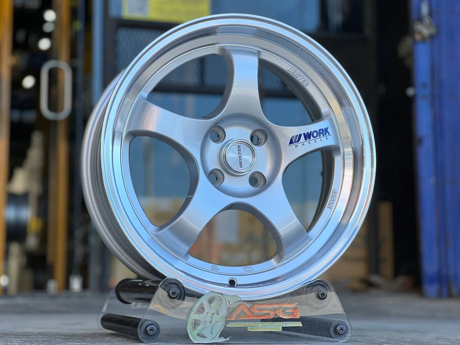 White six-spoke 17-inch sport rim displayed at Ahmad Sportrim Garage