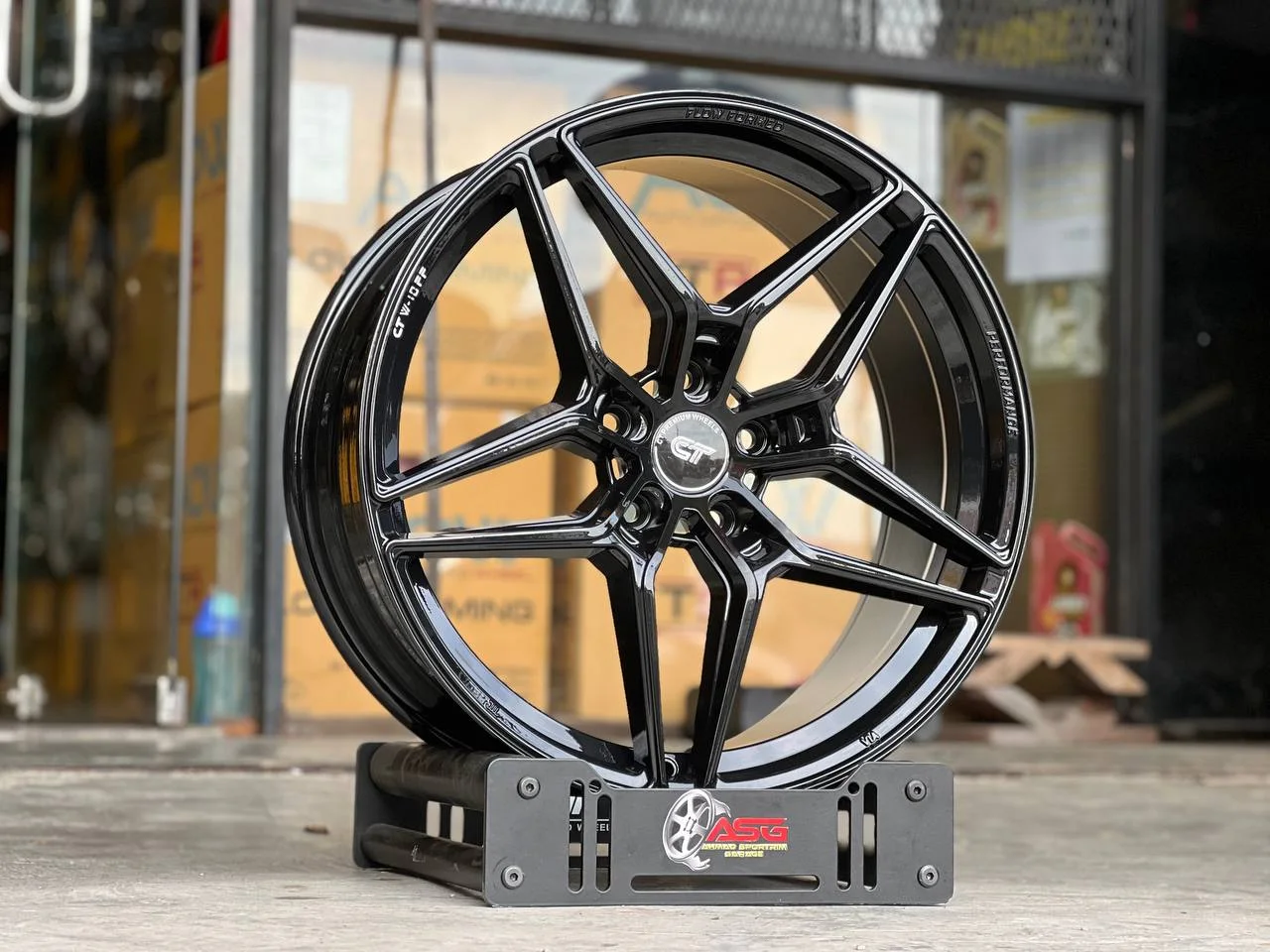 Dark angular split-spoke 19-inch sport rim displayed at Ahmad Sportrim Garage