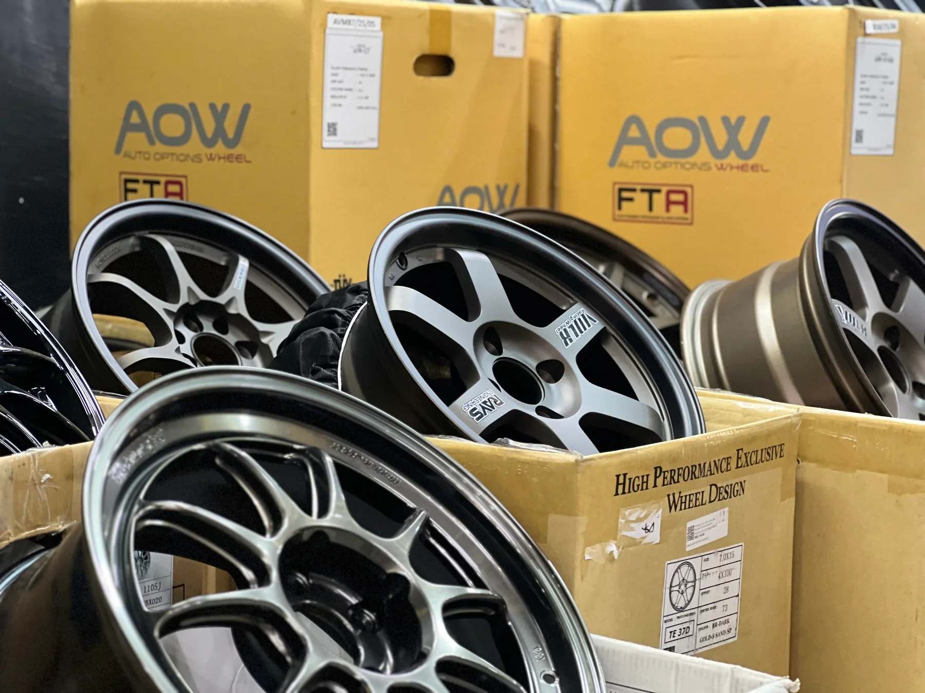 AOW sport rims displayed with boxed wheel stock at ASG