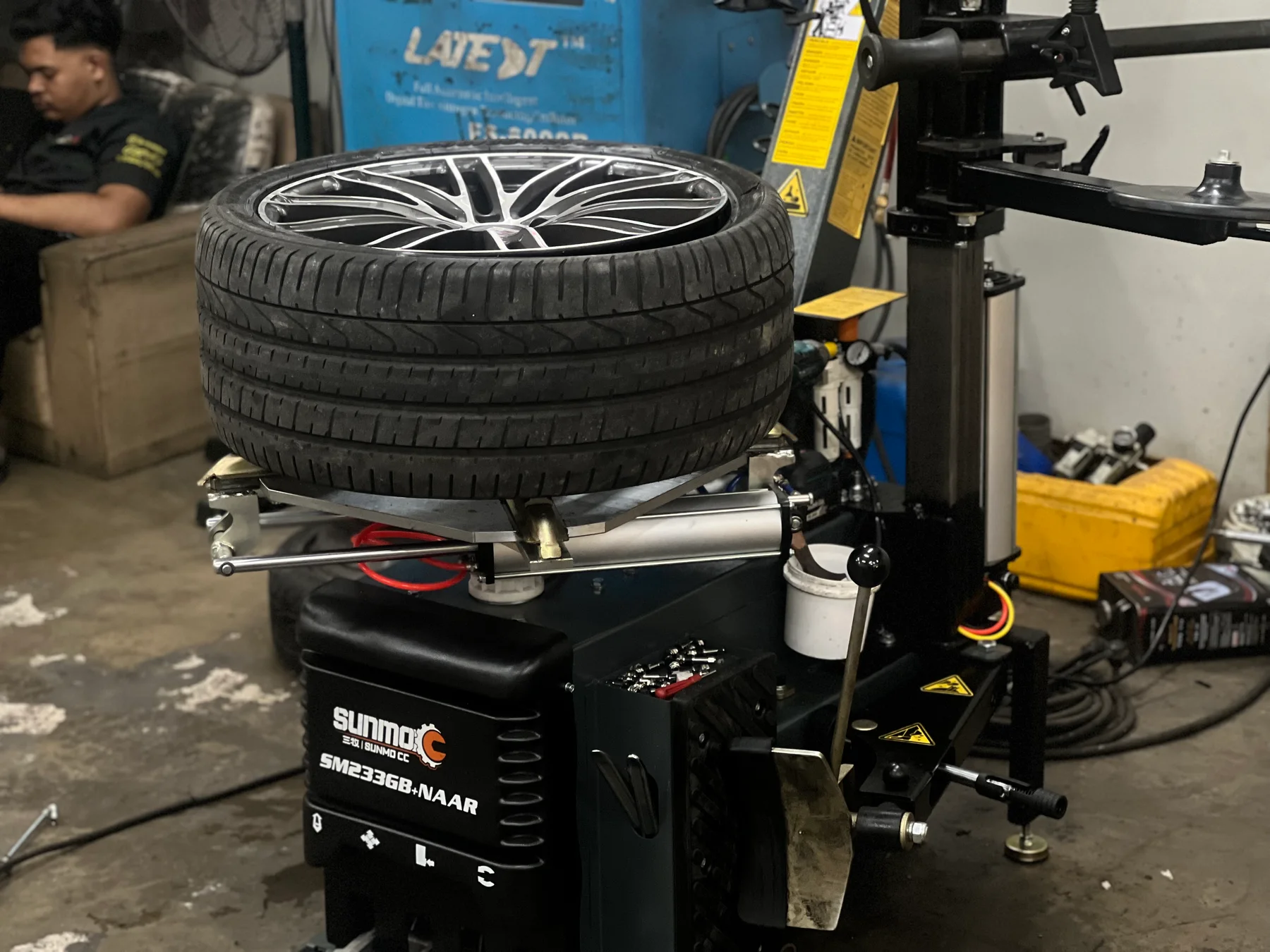 Tyres and wheel mounted on tyre fitting equipment at ASG
